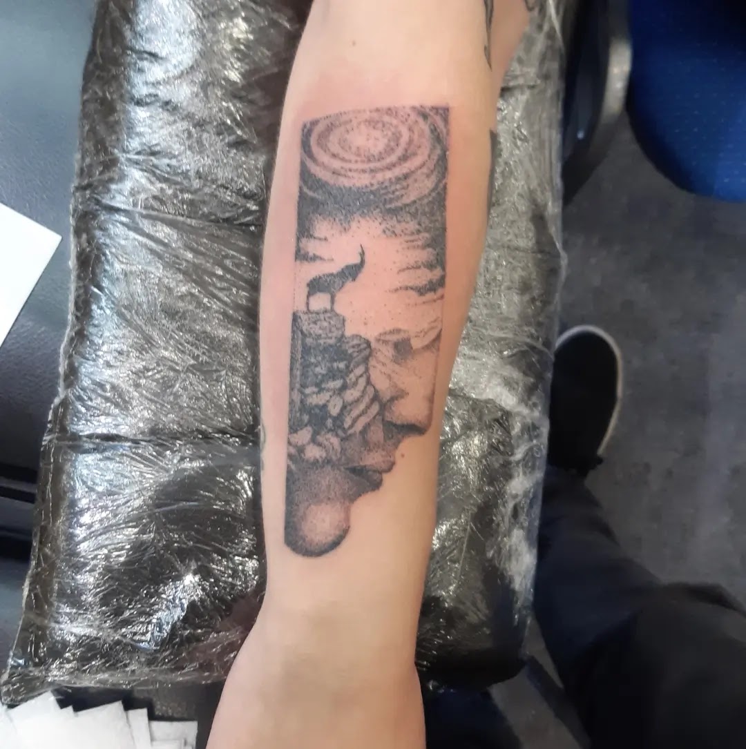 Tatuaje de serpientes en Odisea Body Art